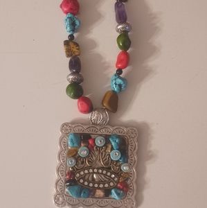 Unique handmade necklace with large silver pendant